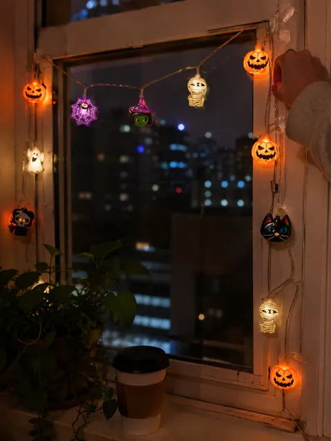 Halloween character lights around an apartment window