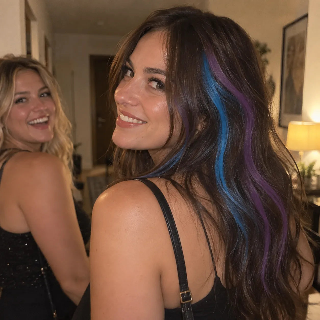 Friends applying blue temporary hair chalk before a concert