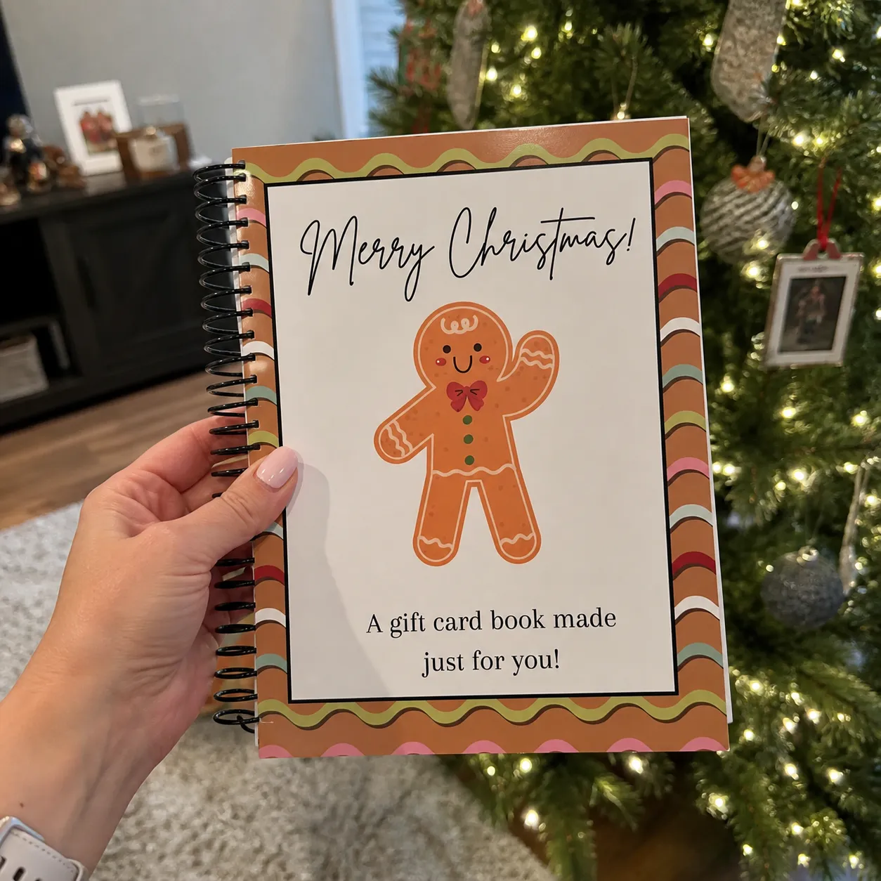 Gift card book by a Christmas tree