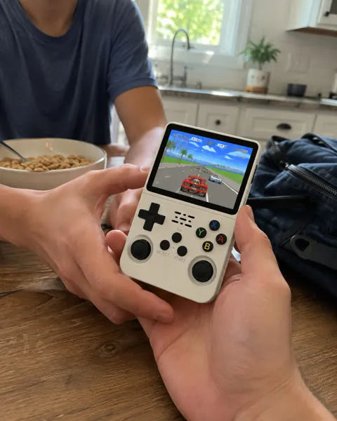 Family sharing the handheld at a kitchen table