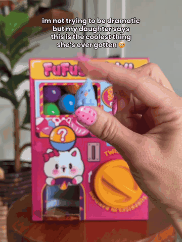 A capsule dropping from the squishy surprise machine