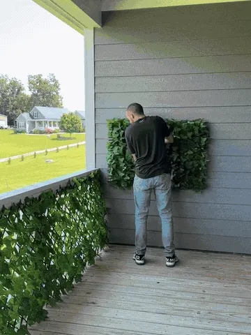 Expandable faux ivy fence opening to cover a balcony railing