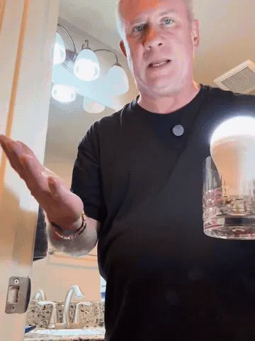 Emergency bulb lighting by water contact, touch, and hanging hook