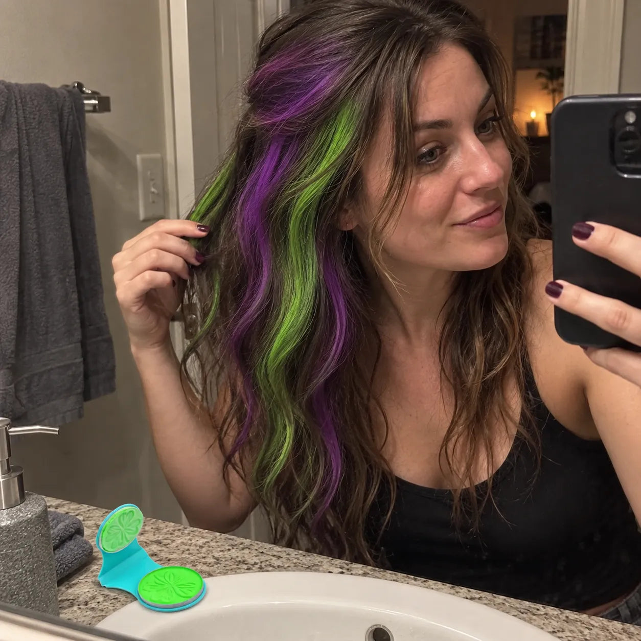 Purple and green temporary hair streaks after a costume party