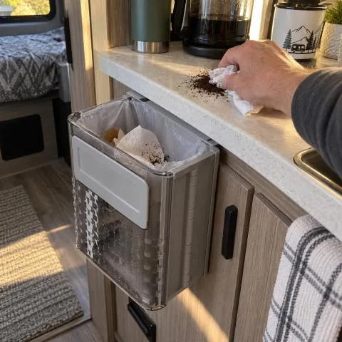 Gray foldable bin in a compact RV kitchenette