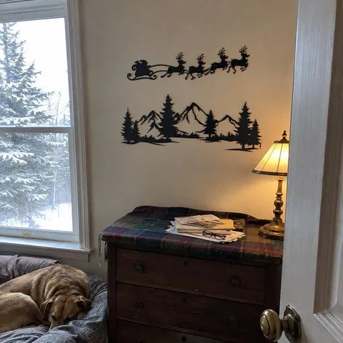 Black metal Christmas wall art in a small guest room on a snowy morning