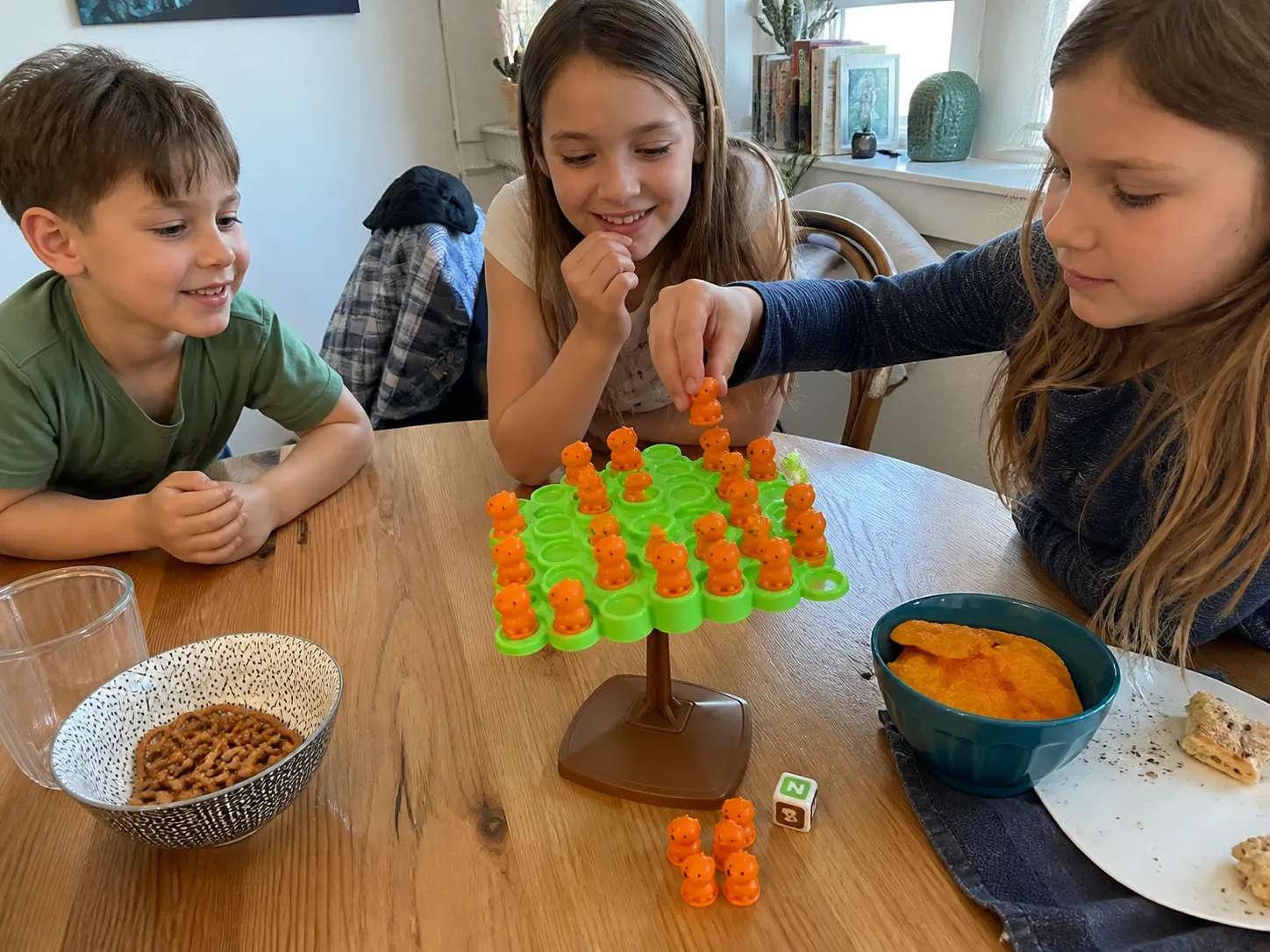 Children taking turns with the capybara balance game at a playdate