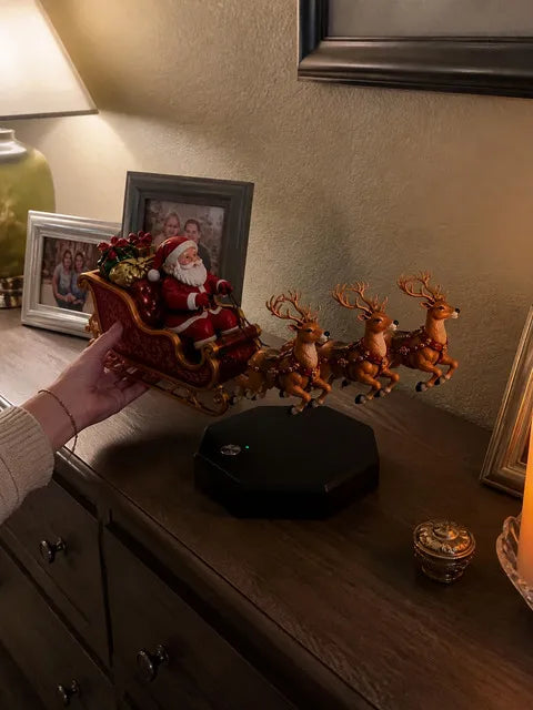 Floating Santa sleigh display being centered on a family sideboard