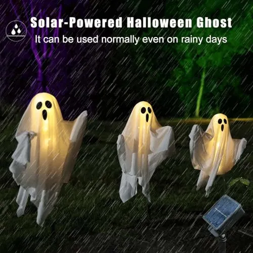 Three warm-white ghost lights outdoors in rainy weather