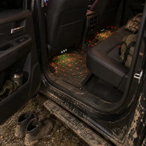 Red and green footwell glow in a used pickup truck