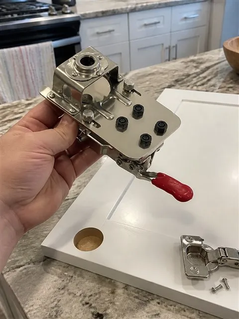 Hinge jig and clean cup hole during a kitchen cabinet update