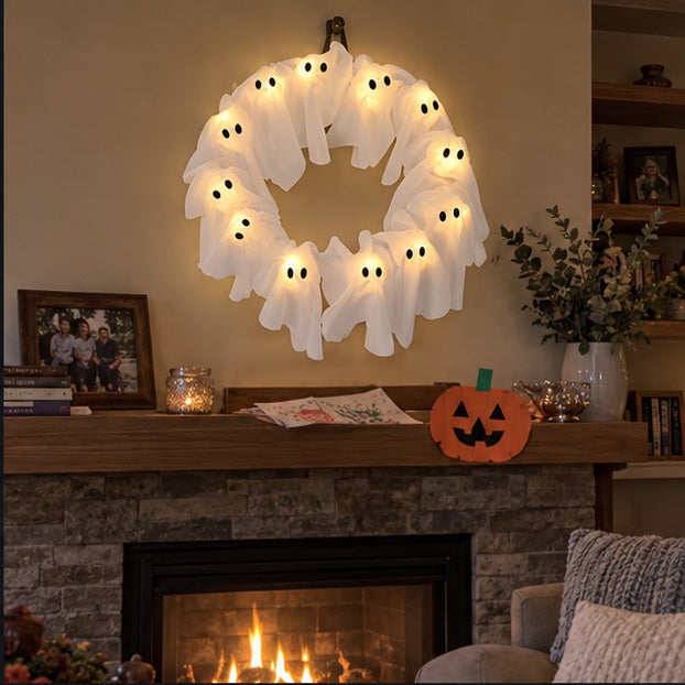Glowing white ghost wreath above a family fireplace mantel