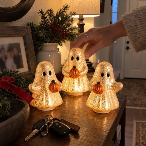 Glowing ghost set displayed on an entryway console
