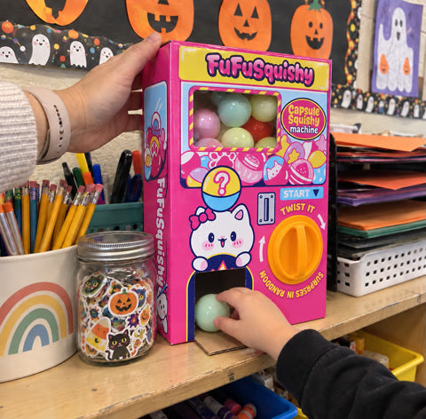 A capsule machine being used on a classroom reward shelf