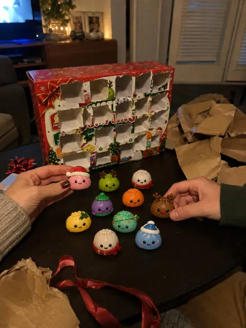 Friends arranging holiday dumpling surprises after opening the gift