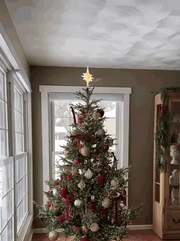 Santa's sleigh circling a glowing Christmas tree star