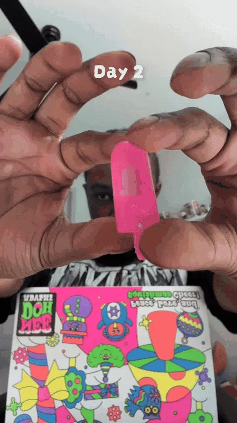 Mini squishy toy being stretched and squeezed