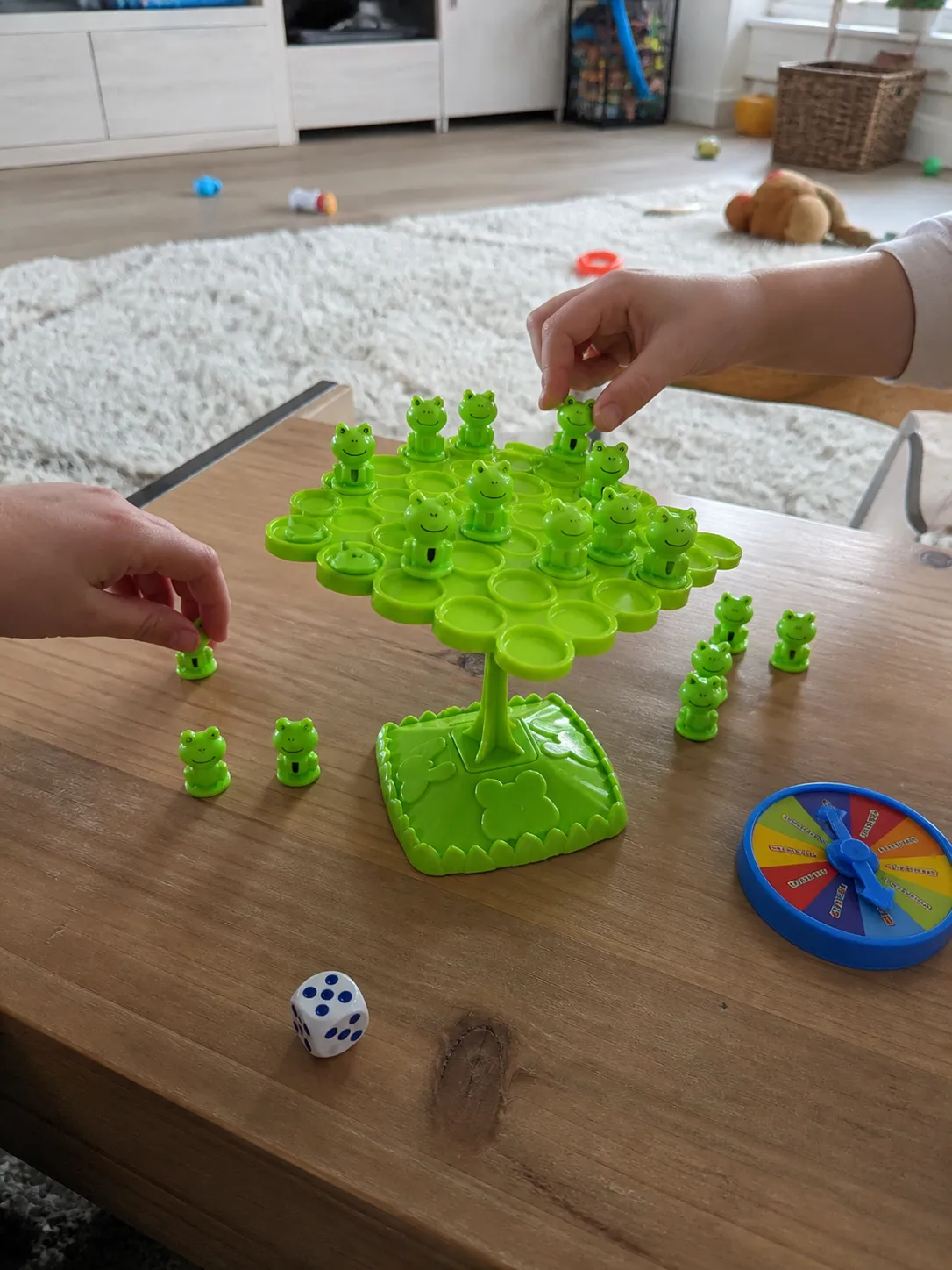 Children playing the frog balance game in a playroom