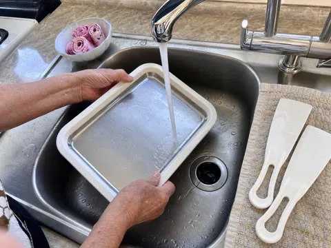 Hand washing the cold plate after use