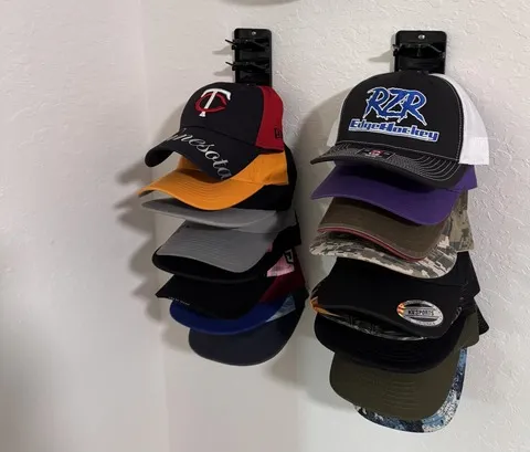 Two compact black organizers displaying baseball caps