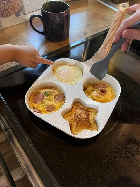 Family pointing to shaped breakfast bites in the pan