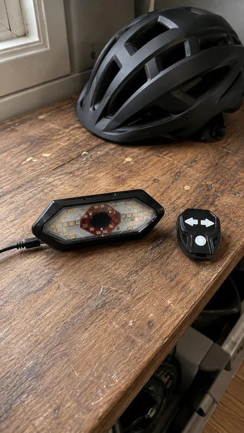Wireless bike tail light and remote charging on a mudroom bench