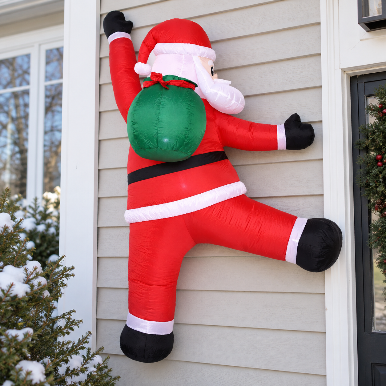 Side and rear details of the wall-climbing Santa and green gift sack