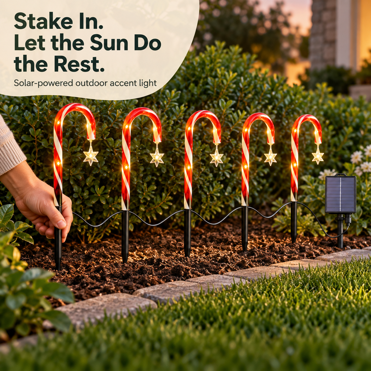 Installing the five-piece solar pathway light set in a garden border