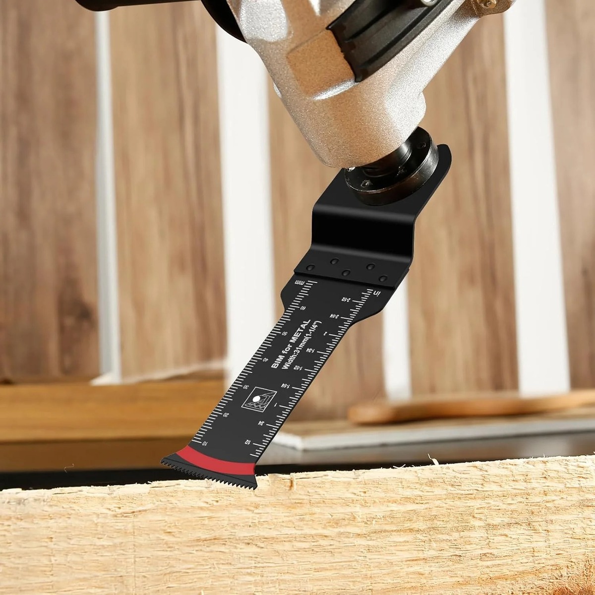 Black oscillating saw blade mounted on a multi-tool and cutting wood