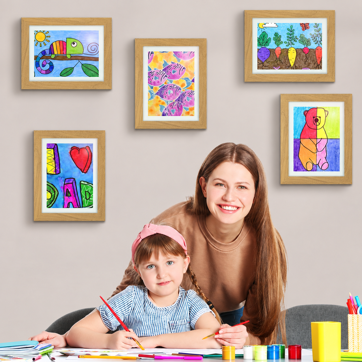 Parent and child beneath a gallery of framed children's art