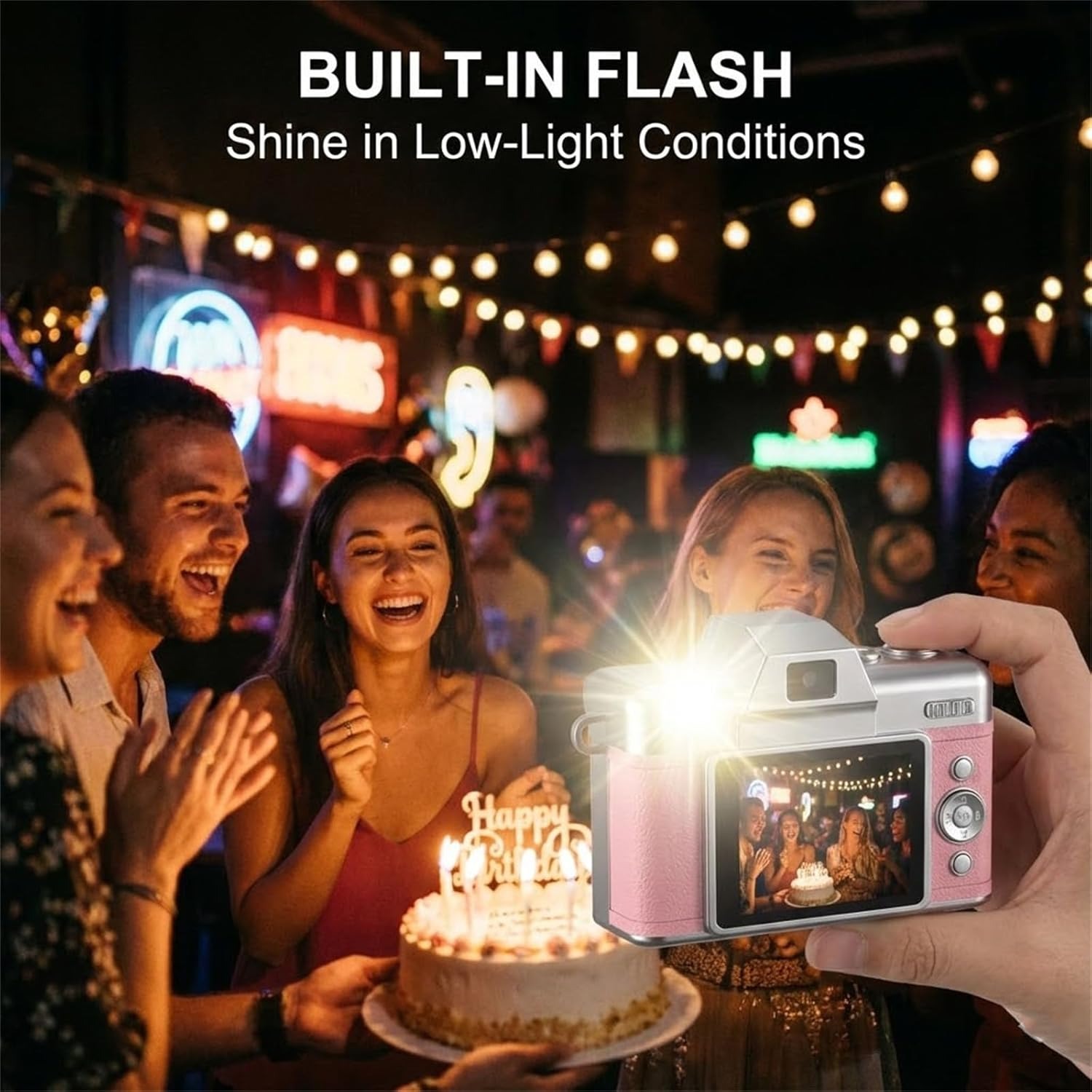 Pink thumb-size retro camera using its built-in fill light in a darker scene