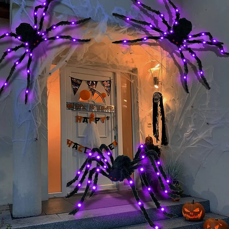 Purple light-up furry spiders around a Halloween porch