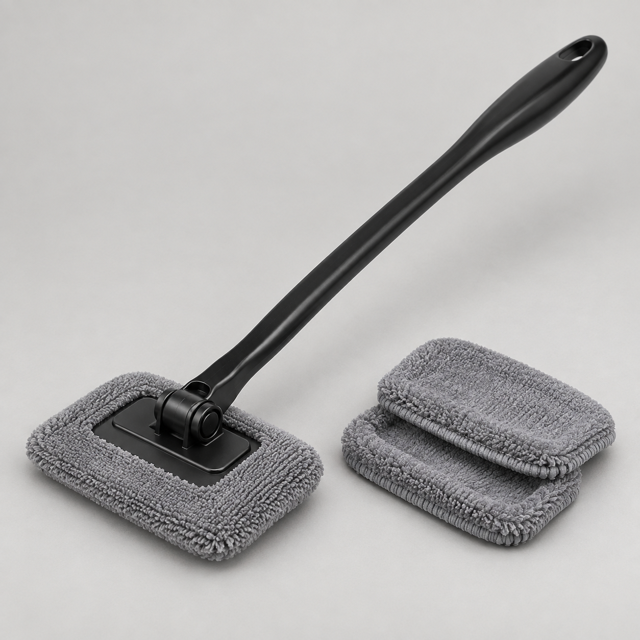 Extendable Windshield Cleaning Tool in a clean studio setting without logos
