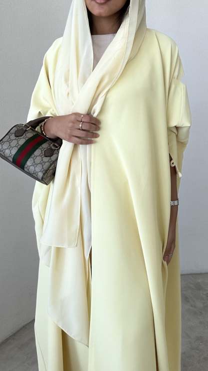 Butter Yellow crepe abaya, bisht style with Pearl Buttons