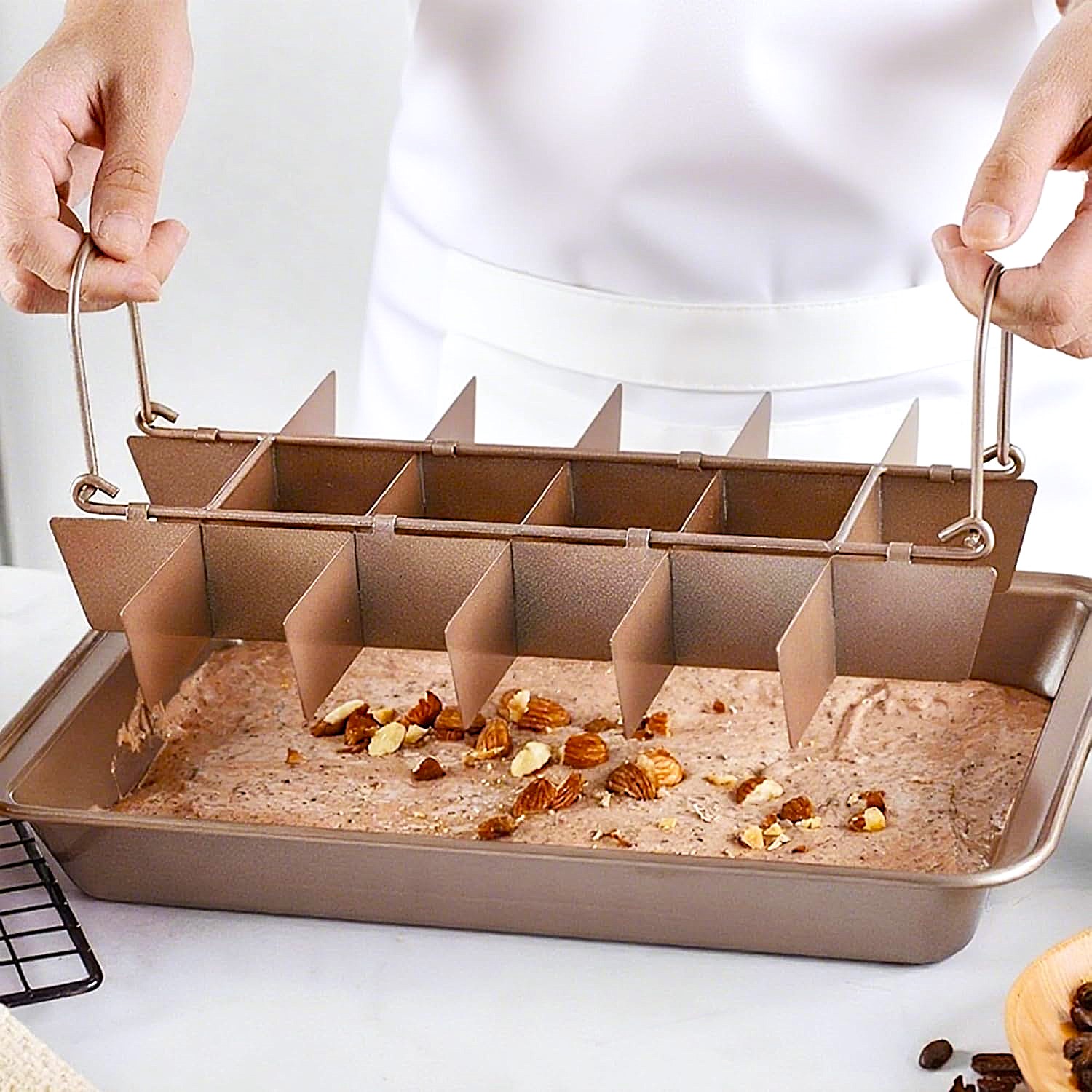 Lifting the removable divider from the brownie pan