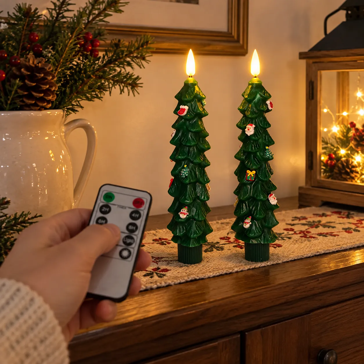 Hand using remote control with the candle pair