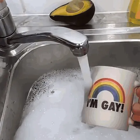 The heat-reveal mug returning to its black cold state under cool water