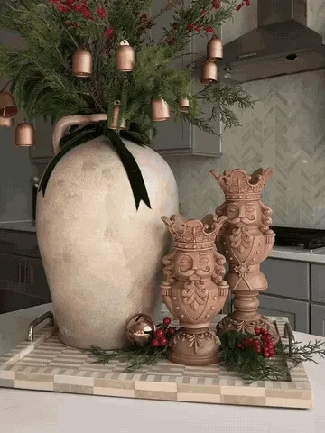 Nutcracker candle holders arranged into a finished Christmas display