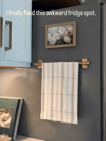 Towel bar turning unused vertical space into convenient towel storage