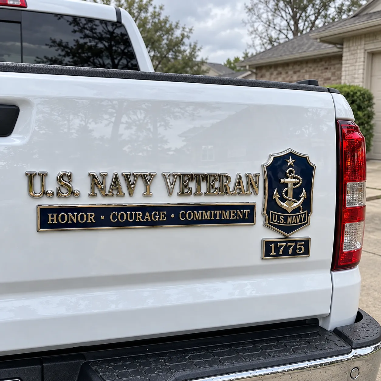 Completed Navy veteran emblem set installed on a white pickup tailgate
