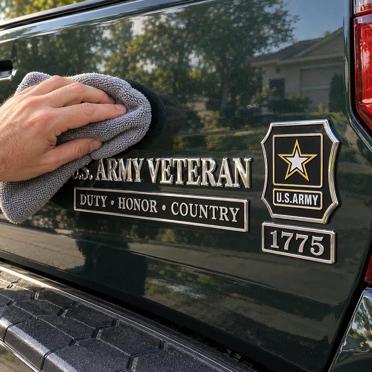 Gently wiping an installed Army veteran emblem with a microfiber towel