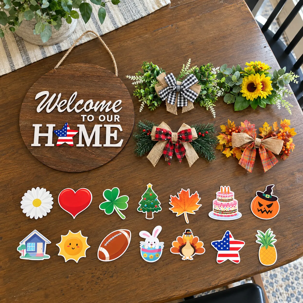 Wooden welcome sign with four toppers and fourteen icons laid out on a table