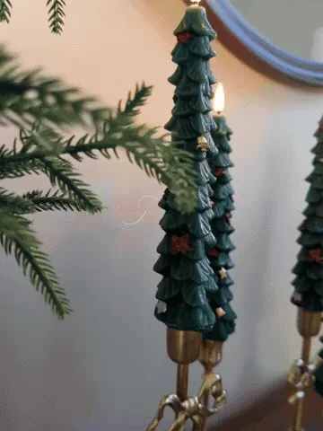 Christmas tree LED candles glowing and responding to the remote