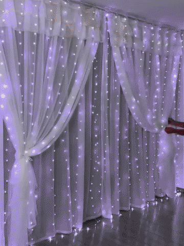 Curtain lights being installed and controlled with the remote