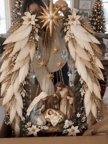 Christmas nativity wall wreath being displayed, hung and illuminated
