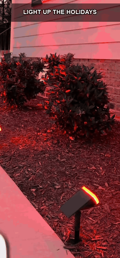 Outdoor RGB landscape lights creating a holiday glow