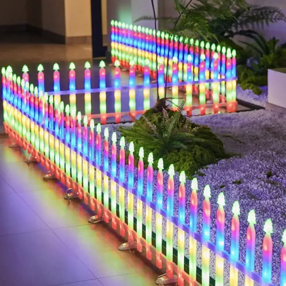 Connected multicolor Christmas fence lights arranged around a display area