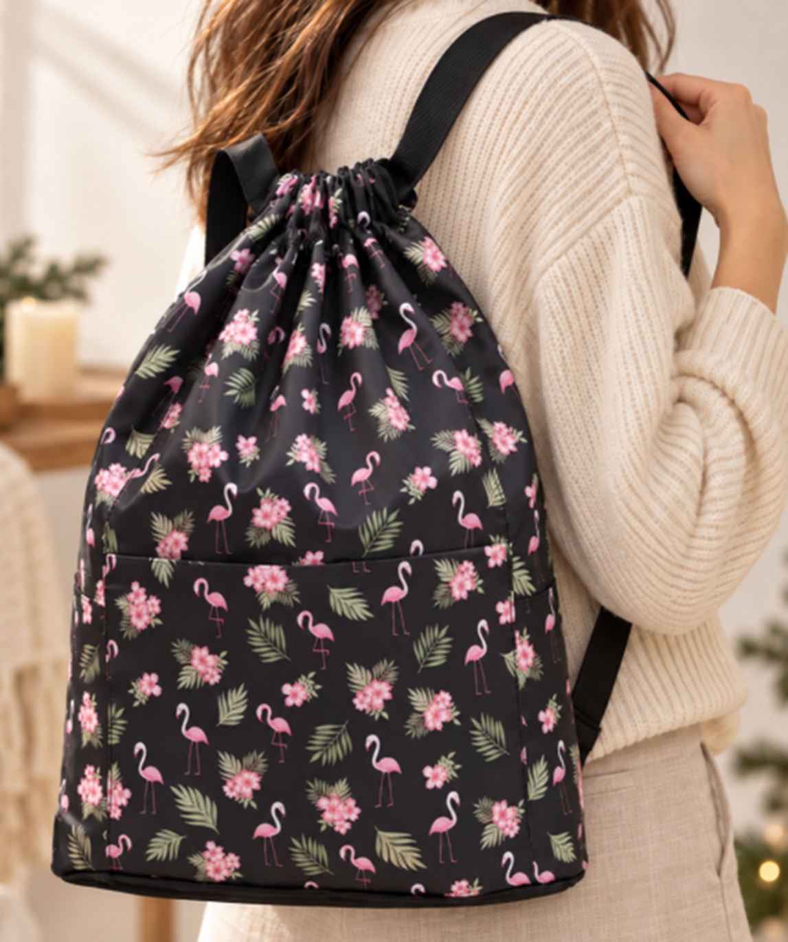Hands folding the backpack into its compact pouch