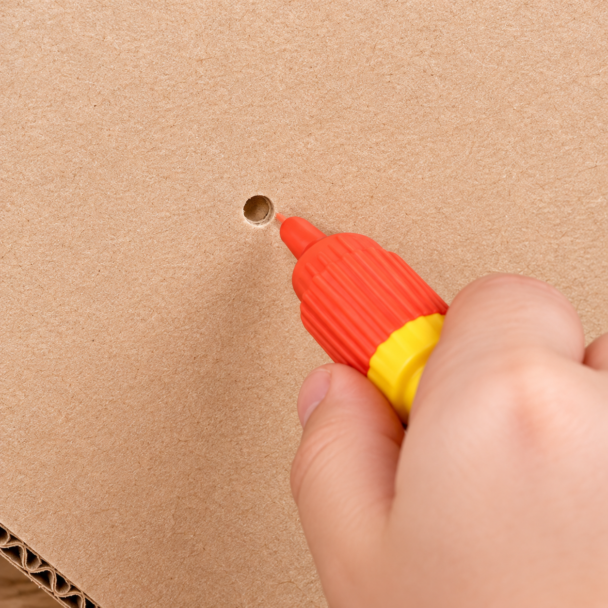 Punching and fastening cardboard pieces