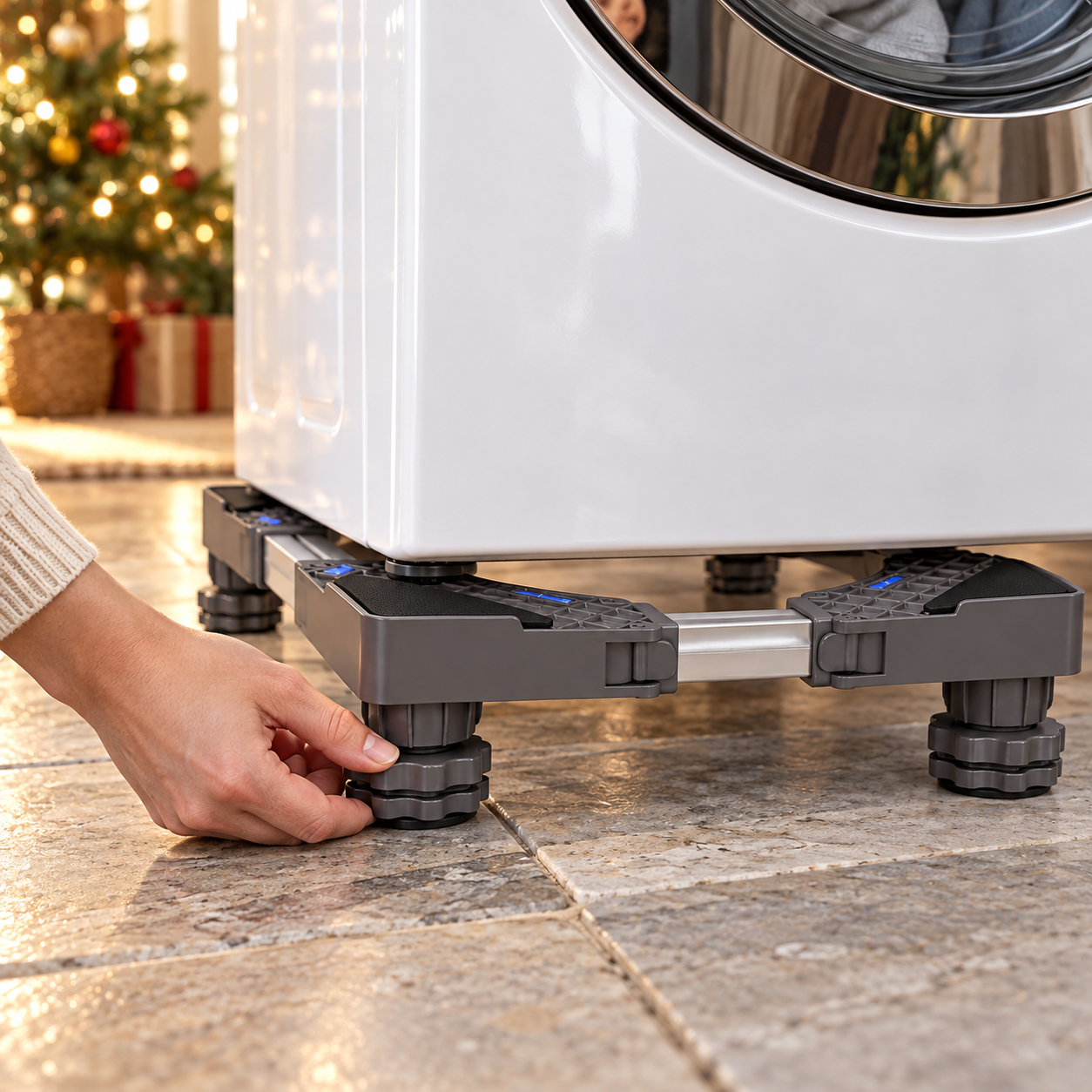 Hand adjusting a leveling foot beneath an appliance